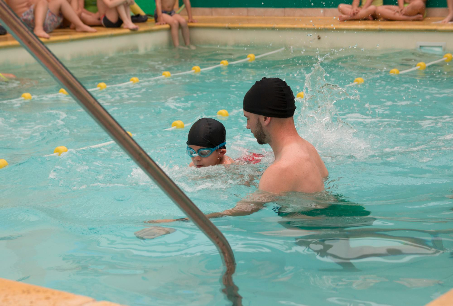 Lane lines stretching across a clean swimming pool
